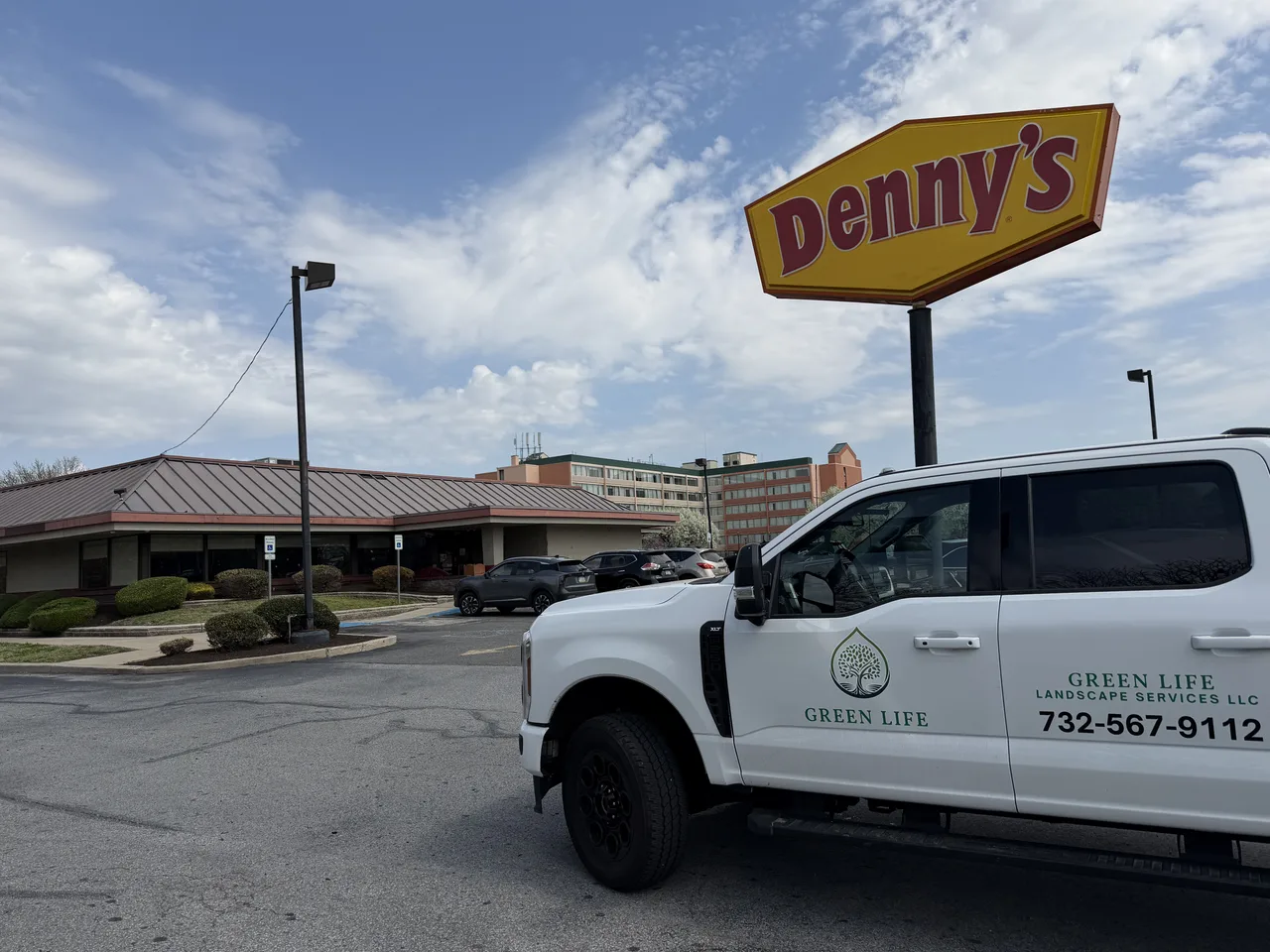 Green Life Landscape Services LLC truck at Denny's restaurant commercial landscaping job Havertown PA
